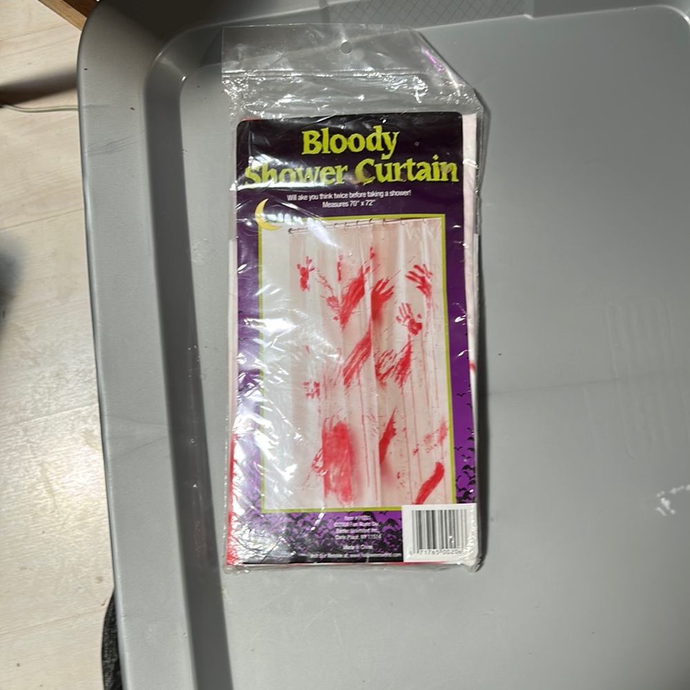 New in package bloody shower curtain perfect for Halloween parties! 70” by 72”